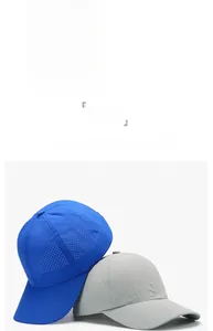 Detail of quick-dry mesh baseball caps showing breathable fabric in dark gray and blue
