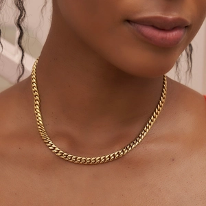 Classic 18K gold plated stainless steel Cuban link necklace worn on model neck