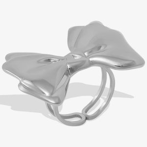 Close-up of polished silver bow ring featuring a minimalist double band open design