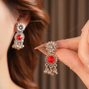 Vintage sunflower drop earrings with red gemstone in antique silver bohemian style