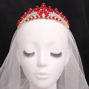 Elegant bridal tiara with red and clear rhinestones on golden base for wedding