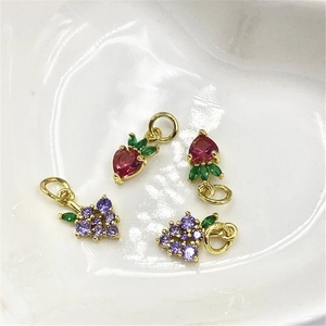 Gold-plated fruit pendants featuring micro-set strawberry and grape cubic zirconia designs
