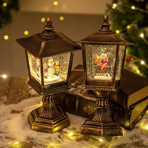 European vintage bronze street lamp Christmas globe with snowman and Santa scene