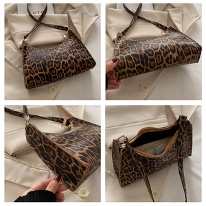 Close-up of leopard print underarm bag details with gold zipper and stylish inner lining