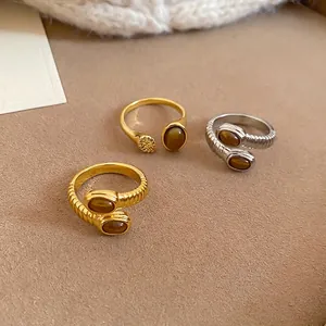 Minimalist vintage open rings set with oval tiger eye stones in gold and silver finish