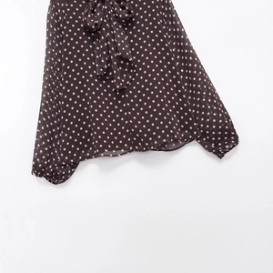 Elegant dark brown polka dot chiffon blouse featuring a chic bow tie neck and long sleeves