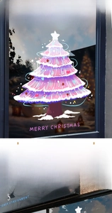 Detail of pink Christmas tree window stickers with Merry Christmas text for glass decor