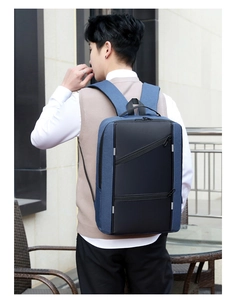 Rear view of business laptop backpack in blue and black with reflective safety stripes
