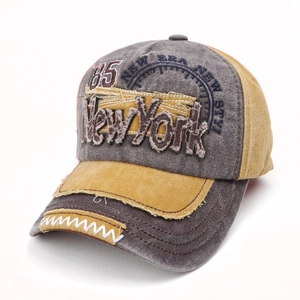Detailed embroidery and distressed denim texture on vintage New York baseball cap