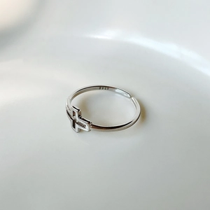 Macro detail of S925 sterling silver stamp on the inner band of the hollow cross ring