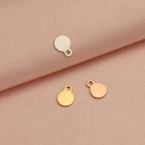 Polished stainless steel round DIY pendants in silver, gold, and rose gold finishes