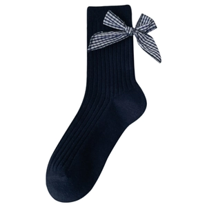 Navy blue lace crew socks with a blue and white checkered bow tie on white background