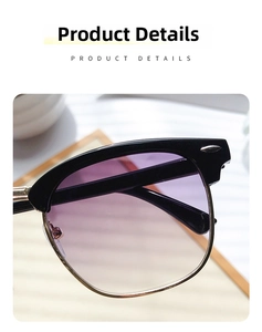 Close-up of semi-rimless sunglasses with purple gradient lenses and gold metal details