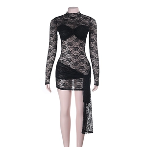 Detailed view of black lace mini dress with high neck and side draped ribbon detail
