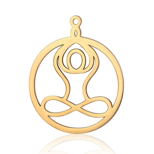 Macro view of gold stainless steel yoga meditation pendant with hollow design and reflection