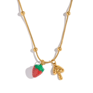 Detail of 18K gold-plated snake chain with strawberry and mushroom pendants