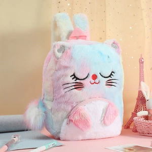 Close-up of rainbow tie-dye plush cat backpack featuring detailed embroidery and soft texture