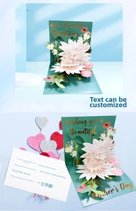 Detail view of 3D pop-up flower card featuring intricate white petals and green base