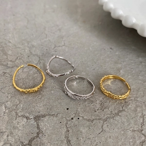 Close-up of S925 sterling silver rings with irregular lava texture and bead accents