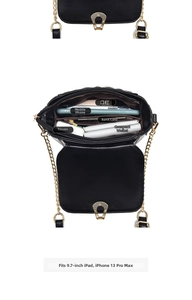 Detailed view of black quilted crossbody bag with golden chain and multi-compartment interior