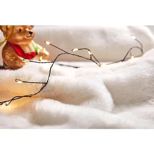 Warm white LED decorative string lights on soft white plush base for Christmas decor