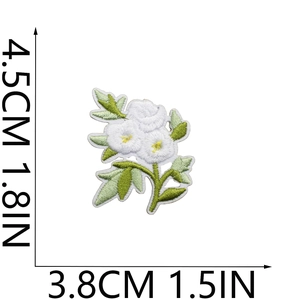 Detailed view of white floral embroidered patch with dimensions 4.5cm by 3.8cm