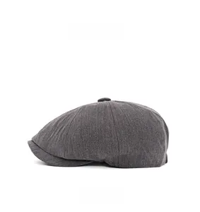 Side view of dark grey herringbone newsboy cap with classic British vintage pattern