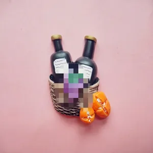 Macro detail of resin miniature wine basket fridge magnet with bottles and fruit