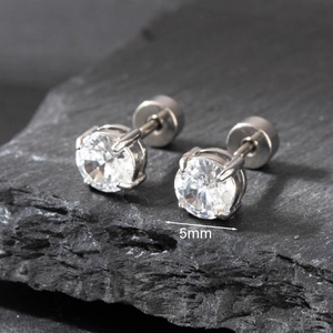 Macro shot of 5mm shiny round zircon stud earrings with polished steel screw back