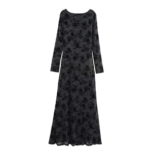 Elegant black long-sleeved glitter knit maxi dress with shimmering floral jacquard patterns
