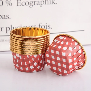Close-up of red gingham muffin cups with gold foil lining and reinforced rolled rim edges