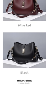 Detail of burgundy and black pebbled leather shell bags with gold U-shaped hardware