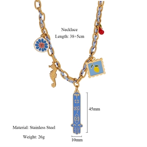 Detail view of gold stainless steel necklace showing dimensions 45mm x 10mm and 38+5cm chain