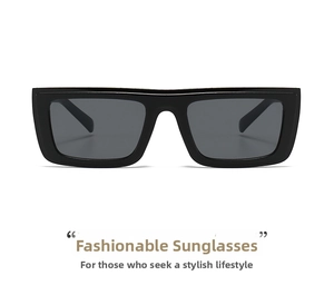 Detail of trendy black rectangular square frame sunglasses with solid dark lenses