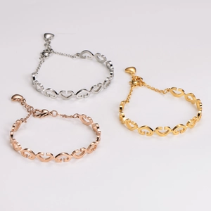 Three-color linked heart bracelets in silver, gold, and rose gold stainless steel