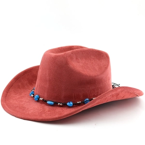 Close-up of brick red felt cowboy hat with ethnic bead band and wide brim detail
