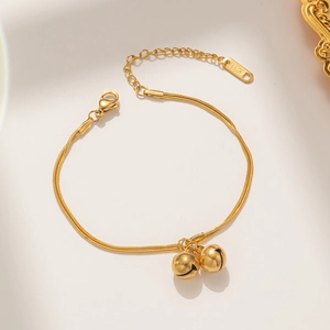 Double-layered golden titanium steel bracelet with two round bells and 18KGP tag