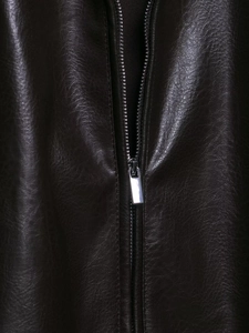 Detail of premium dark coffee PU leather texture with silver metal zipper fastener