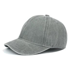 Detail of dark grey washed cotton fabric and stitching on a vintage short brim cap