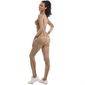 Detail of seamless knit yoga set showing breathable textures and geometric compression patterns
