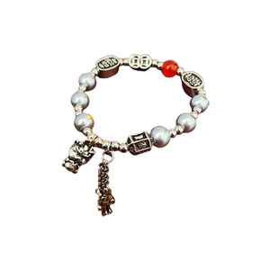Beaded dragon bracelet with red fortune charm and silver pearls for Lunar New Year