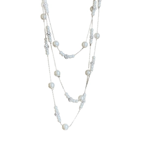 French retro layered pearl necklace with diamond accents and silver beads on white background