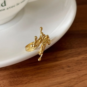 Elegant 925 sterling silver gold branch ring with organic minimalist design on white plate