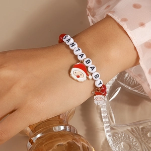 Detail of Christmas beaded bracelet with SANTABABY letter beads and Santa Claus charms