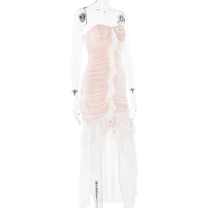 Detail of pink strapless dress featuring ruffled textures and irregular mesh hemline