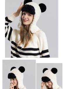 Detail view of plush panda ear flap hat with fluffy faux fur and cute 3D ears