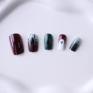 Halloween press-on nails with red gradient, spider patterns, and ghost designs