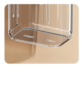 Macro view of clear plastic bathroom rack with drainage holes for water removal