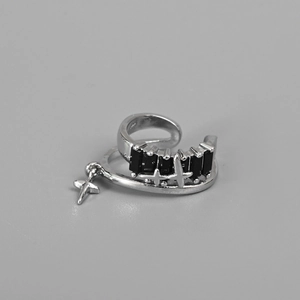Silver star cross ear cuff with black zircon stones in a trendy minimalist design