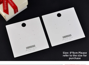 Close-up of 8x8cm white jewelry display card for earrings with Silver S925 text logo